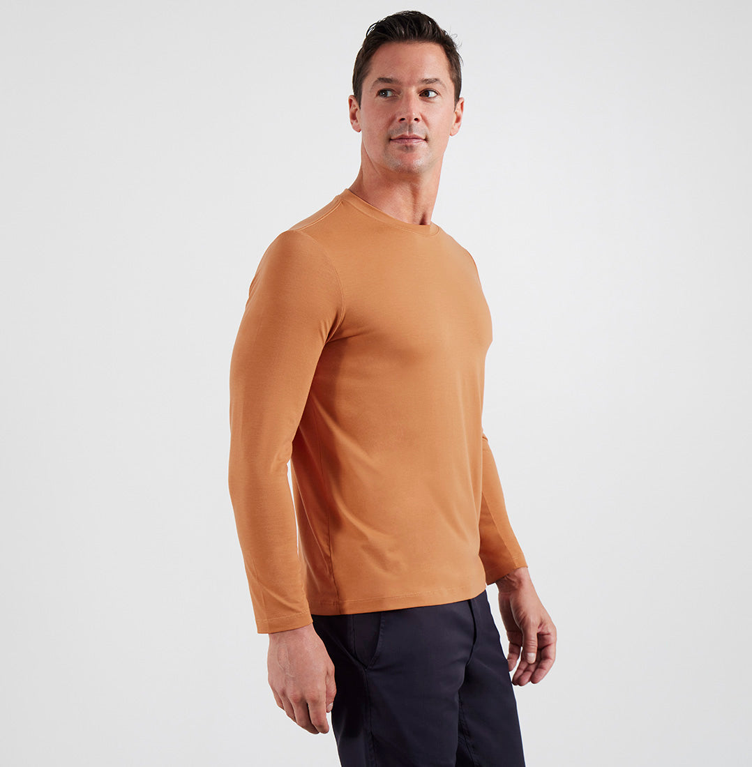 Side view of model wearing Threshold LS Rustic Orange T-shirt